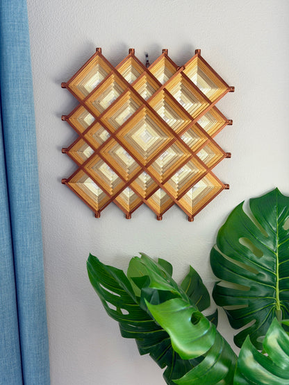 Handcrafted Mexican mandala wall hanging with geometric thread design symbolizing abundance, created in Oaxaca, Mexico by Cuicari Mandalarte.