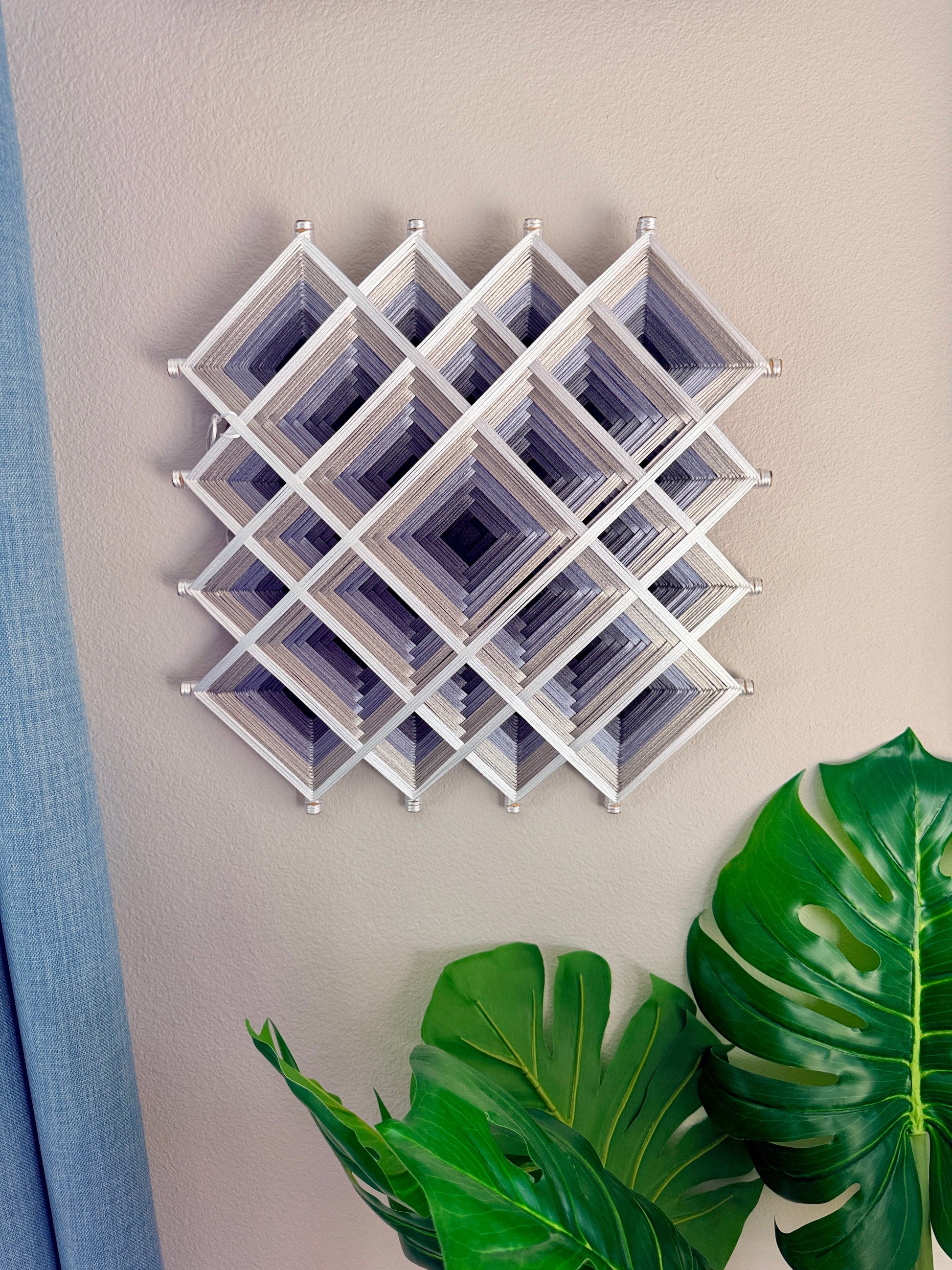 Handmade Process Mandala by Oaxacan artisan Cuicari Mandalarte in white and gray sacred geometry thread design.